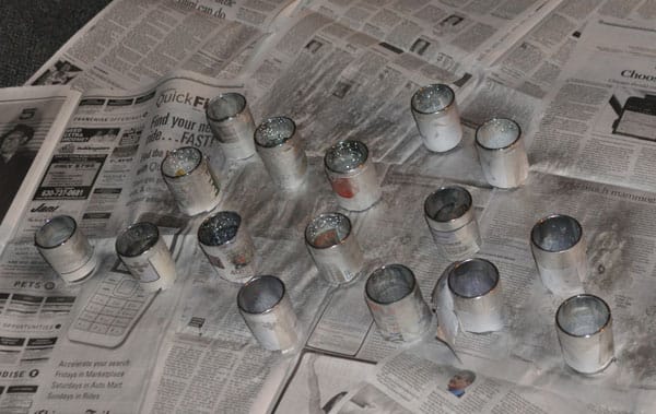 votive holders being painted